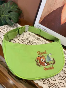 Green nylon crescent dumpling crossbody bag with cute squirrel embroidery, daily casual style.