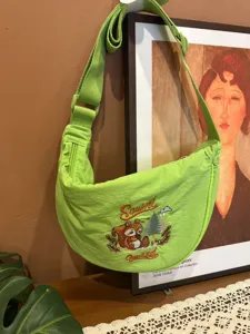 Green nylon dumpling crossbody bag with cute squirrel embroidery, casual daily shoulder purse.