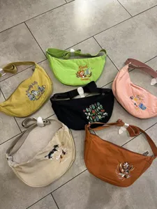 Nylon dumpling crossbody bag with cute embroidery, versatile casual shoulder bag for women.