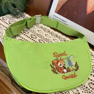 Green nylon crescent dumpling crossbody bag with cute squirrel embroidery, casual daily shoulder bag.