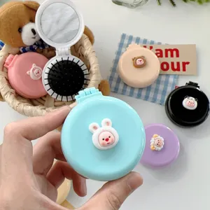 Brosse à cheveux pliante mini portable avec miroir intégré, peigne de massage mignon pour femmes.