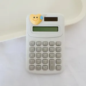 Cute cartoon mini calculator with heart charm, portable small desktop tool for school and office.