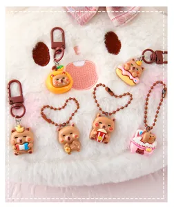 Cute cartoon capybara resin keychains with various fun designs for bags and keys.