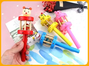 Wooden baby rattle toy with cartoon puppet head and bell inside, colorful sensory grasping toy.