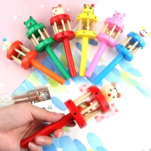 Wooden baby rattle toy with cartoon animal head and ringing bell, colorful infant toy.