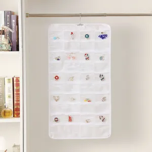 Detail view of double-sided hanging jewelry organizer with clear pockets for earrings and rings