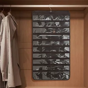 Hanging jewelry organizer detail, transparent pockets for necklaces in wardrobe display.