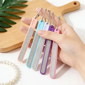 Close-up of colorful nail files with bead chains, showing fine abrasive surface and design.
