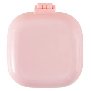Roze opvouwbare zakhaarborstel met spiegel, handige mini reishaarstyling tool voor onderweg.