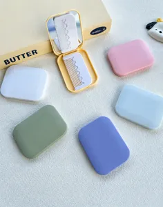 Portable folding makeup mirror and comb combo detail view, multi-color pocket mirror design.