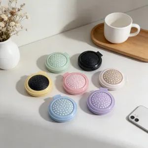 Portable folding mini hairbrush with mirror in cute candy colors, compact travel massage comb.