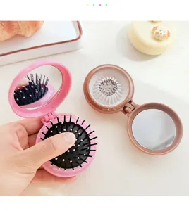 Portable folding hair brush with mirror, cute mini pocket air cushion comb for daily hair styling.