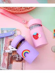 Mini silicone barrel coin purse and earphone storage bag with cute keychain and strap.