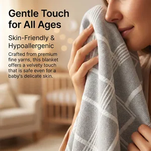 Detail view of the soft grey knitted blanket showing its delicate texture and skin-friendly fabric.