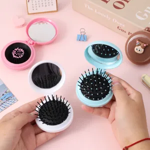 Brosse à cheveux pliante compacte avec miroir, mini brosse de massage à coussin d'air portable.