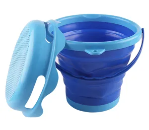 Detail view of collapsible beach bucket and sifter lid, flexible portable design for sand play.