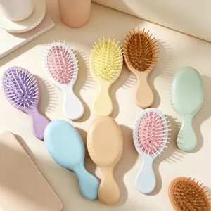 Mini brosse a cheveux pour enfants et femmes, brosse de massage portable pour un usage quotidien.