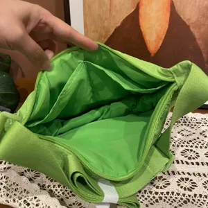 Green nylon crossbody bag, casual dumpling shoulder bag with multiple inner pockets for daily use.