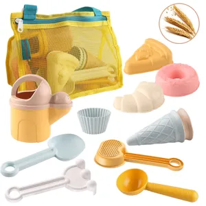 Kids beach toy set with mesh bag, watering can, sand molds and shovels for outdoor play.