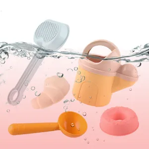 Children beach toy set with watering can and sand tools for outdoor fun and water play.