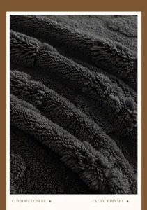 Close-up detail of dark grey plush sofa cover fabric, soft texture and cozy daily home use.