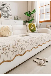 Chenille non-slip sofa cover with jacquard floral pattern and irregular scalloped edge.