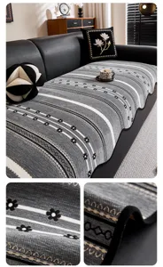 Sofa cushion detail showcasing jacquard texture, grey striped pattern, and fine edging.