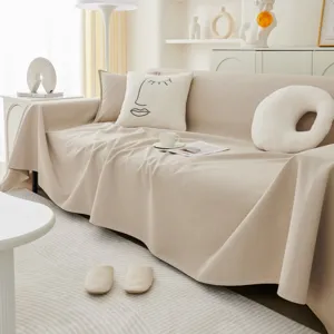 Housse de canape minimaliste unie et impermeable en polaire teddy d'ete pour le salon.