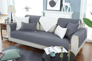 Quilted sofa cover detail view showing modern minimalist non-slip fabric cushion texture.