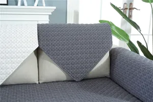 Quilted sofa cover detail showcasing soft grey texture and anti slip diamond stitching design.