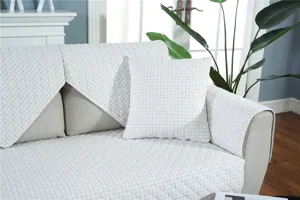 Detailed close-up showing the fine quilted texture and grid pattern of the premium sofa cover.