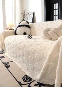 Close-up detail of the cozy plush sofa cover featuring cute 3D paw print textures in soft beige.