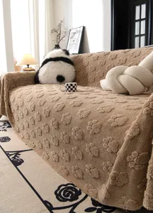 Detail shot of brown plush sofa cover with cute paw print texture, cozy living room decor.