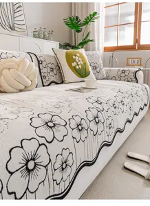 Chenille anti-slip sofa cover detail, elegant floral pattern, soft home textile for living.