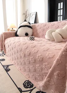 Cute pink paw print velvet sofa cover, soft plush throw blanket for living room decor.