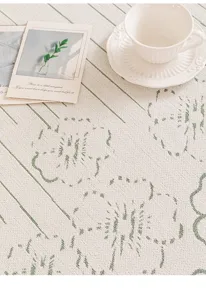 High-end chenille anti-slip sofa mat with elegant green jacquard pattern for home decor.