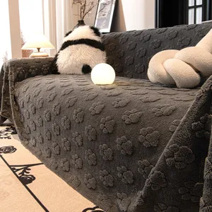 Dark grey plush sofa cover with cute paw print design, soft fuzzy fabric for cozy living room decor.