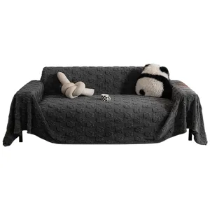 Dark grey plush sofa cover with cute paw print pattern, cozy velvet full wrap slipcover.