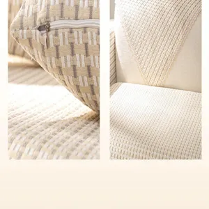 Dettaglio cuscino divano a quadri in cotone, texture delicata e pratica chiusura lampo.
