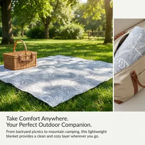 Lightweight outdoor picnic blanket with leaf print and portable carry bag for camping.