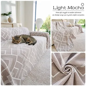 Cozy Nordic style geometric throw blanket, breathable air blanket detail and soft sofa scene.