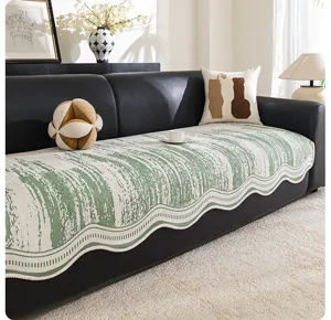 Detail of the modern luxury chenille sofa cushion with green textured pattern and wavy edge.