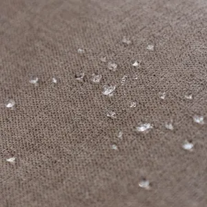 Waterproof chenille sofa cover fabric closeup showing superior water resistance and soft texture.