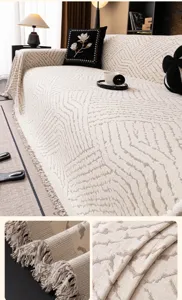 Nordic style jacquard sofa cover detail showing soft knitted texture and bottom tassels.
