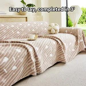 Detail view of three-layer yarn jacquard sofa cover featuring elegant leaf patterns and stripes.