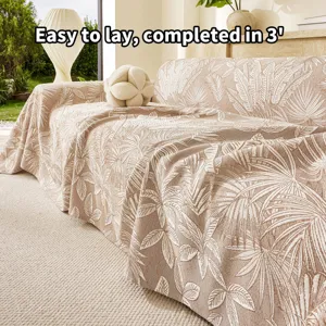 Jacquard sofa cover detail, three-layer yarn beige blanket featuring elegant leaf pattern.