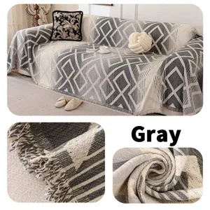 Dettaglio telo divano in ciniglia geometrico nordico con trama di qualità e colore grigio.