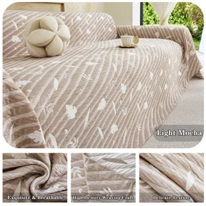 Detailed view of the three-layer gauze jacquard sofa cover in light mocha, showing delicate texture.