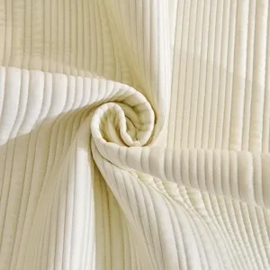 Cream style white cooling ice silk sofa cushion fabric close-up view with fine ribbed texture
