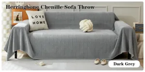 Detalle de manta de sofa chenilla espiga gris oscuro, textura suave y estilo acogedor.